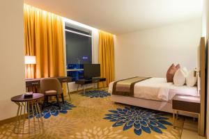 Postel nebo postele na pokoji v ubytování Tamu Hotel & Suites Kuala Lumpur