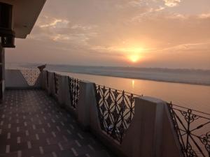 a view of the sunset from a bridge over the river at Scindhia Guest House in Varanasi