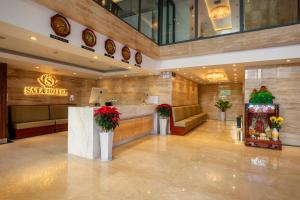 a lobby of a hotel with a restaurant at Sata Hotel in Nha Trang