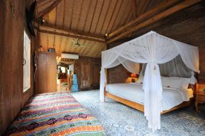 Postel nebo postele na pokoji v ubytování Bali Lush