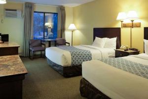 Ένα ή περισσότερα κρεβάτια σε δωμάτιο στο Econo Lodge Mayo Clinic Area