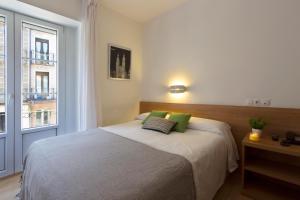 Postel nebo postele na pokoji v ubytování Hostal La Numantina