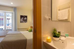 Postel nebo postele na pokoji v ubytování Hostal La Numantina