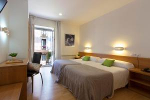 Postel nebo postele na pokoji v ubytování Hostal La Numantina