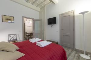 Posteľ alebo postele v izbe v ubytovaní Ponte Vecchio's Nest
