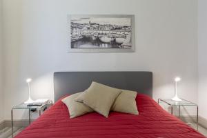 Posteľ alebo postele v izbe v ubytovaní Ponte Vecchio's Nest