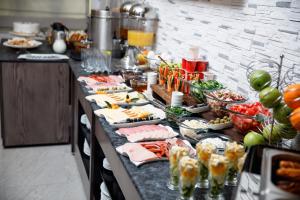 a buffet line with many plates of food at Parallel Hotel in Baku
