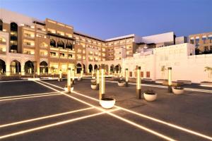 
a city street filled with lots of tall buildings at Al Najada Doha Hotel by Tivoli in Doha

