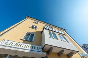 a building with a sign for a hotel at Liebig-Hotel in Gießen