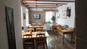 a kitchen and dining room with tables and chairs at Gästehaus Gerlinger in Rothenburg ob der Tauber