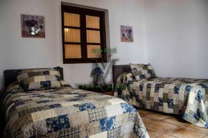Posteľ alebo postele v izbe v ubytovaní Casa Rural VILLAMADA + 37 fotografií