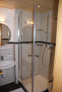 a bathroom with a shower and a sink at Haus Ornach in Oberjoch