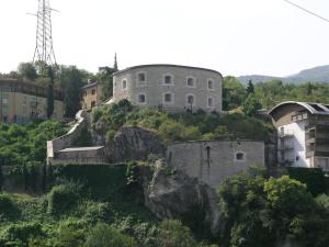 a building on the side of a mountain at Appartamento Ellen in Nago-Torbole