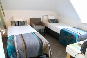 Postel nebo postele na pokoji v ubytování Villa Valkenburg