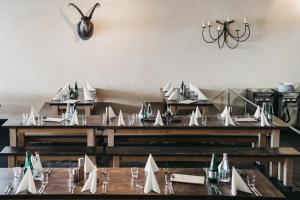 a dining room with tables with paper boats on them at GALAAXY Mountain Hostel in Laax