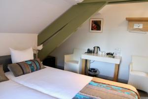 Postel nebo postele na pokoji v ubytování Villa Valkenburg