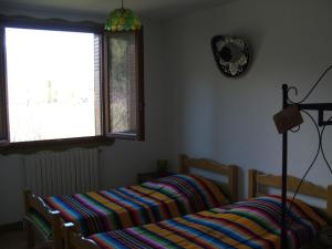 Lova arba lovos apgyvendinimo įstaigoje Maison d' hôtes Tranquyl