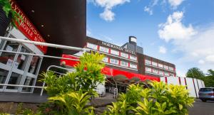 a view of a building with plants in front of it at Normandy Hotel (Near Glasgow Airport) in Paisley