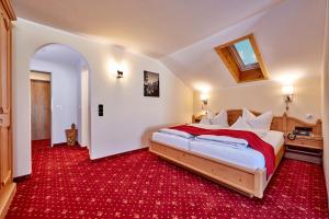 Postel nebo postele na pokoji v ubytování Hotel Franziska