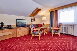 TV a/nebo společenská místnost v ubytování Hotel Franziska