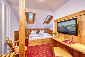 Postel nebo postele na pokoji v ubytování Hotel Franziska