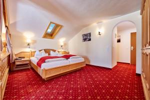 Postel nebo postele na pokoji v ubytování Hotel Franziska