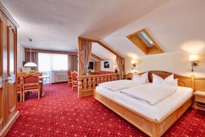 Postel nebo postele na pokoji v ubytování Hotel Franziska