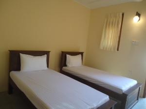 Postel nebo postele na pokoji v ubytování New Sanmi Resort