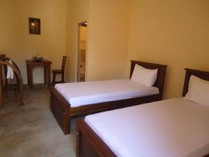 Postel nebo postele na pokoji v ubytování New Sanmi Resort