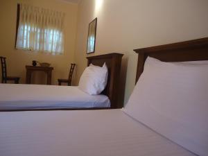 Postel nebo postele na pokoji v ubytování New Sanmi Resort