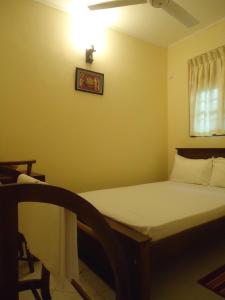 Postel nebo postele na pokoji v ubytování New Sanmi Resort