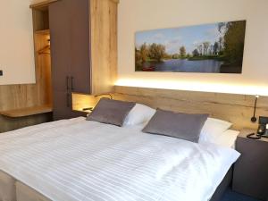 Säng eller sängar i ett rum på Landhaus Beckmann