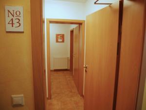 a hallway with a door leading into a room at Fewo No.43 am Rathaus in Willingen +34 photos