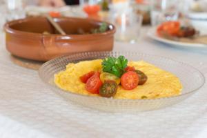 a plate of food on a table at Agroturismo Son Vives Menorca - Adults Only in Ferreries