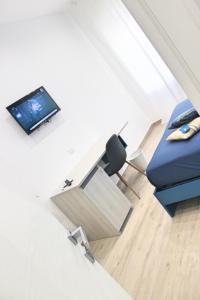 Телевизор и/или развлекательный центр в La Casa del Corallo