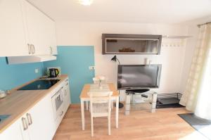Kuchyňa alebo kuchynka v ubytovaní Apartament Malta Poznań