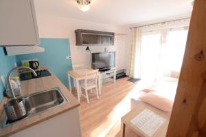Kuchyňa alebo kuchynka v ubytovaní Apartament Malta Poznań