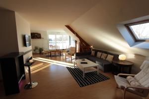 a living room with a couch and a table at Loire Terrasse in Tours