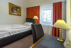 Postel nebo postele na pokoji v ubytování Hotel Adler