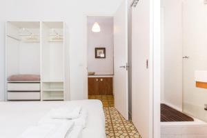 Rúm í herbergi á Montaber Apartment - Gracia