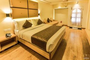 Darshan Hotel客房内的一张或多张床位
