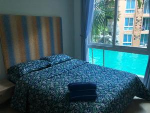 Postel nebo postele na pokoji v ubytování Atlantis Condo Resort jomtien