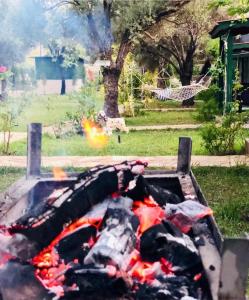 a fire in a grill in a park at My Bungalov in Mesudiye
