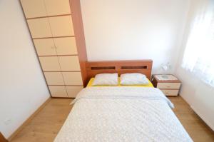 Posteľ alebo postele v izbe v ubytovaní Apartament Malta Poznań