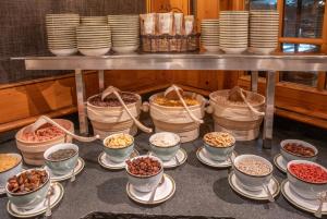 a bunch of bowls of food on a table at Riffelalp Resort 2222m in Zermatt