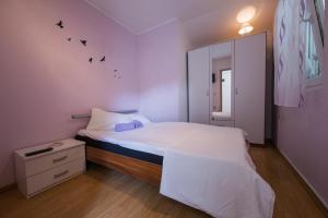 Postel nebo postele na pokoji v ubytování Strma Apartments
