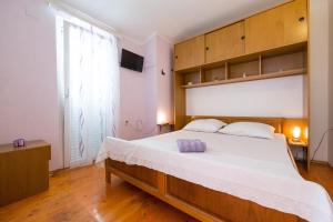 Postel nebo postele na pokoji v ubytování Strma Apartments