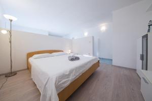 Postel nebo postele na pokoji v ubytování Strma Apartments