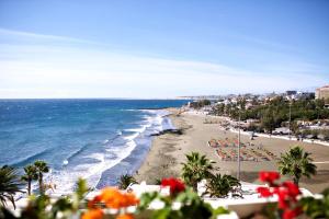 a view of a beach with chairs and the ocean at Dreamy Sea View Accommodation Gran Canaria in San Agustin