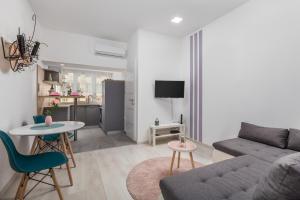 a living room with a couch and a table at Apartment Lucia in Rijeka